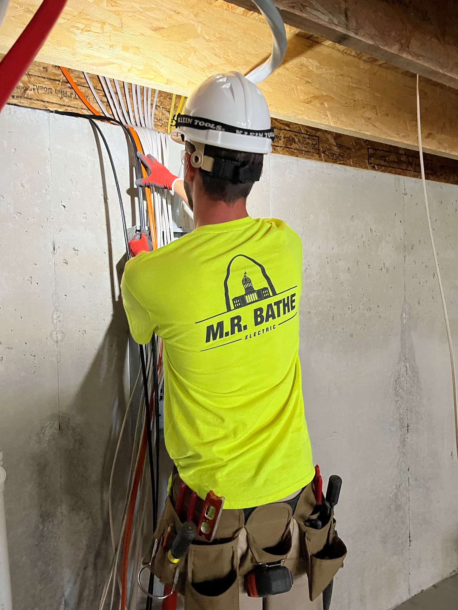 Person arranging electrical cables