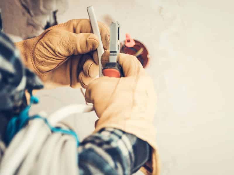 Person working on electrical wires